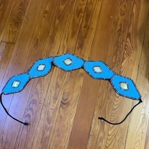 Turquoise/mother of pearl belt with self ties.